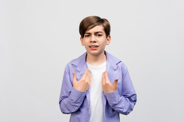 Shocked pretty boy with offended pride pointing himself as staring questioned and insulted
