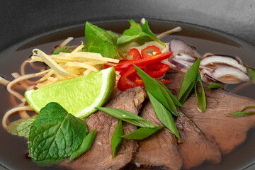 Asian soup with beef and udon noodles