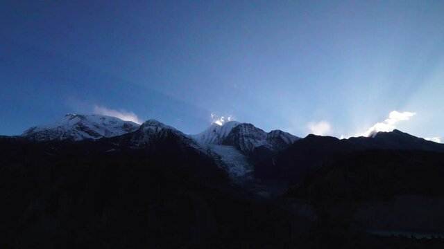 Beautiful sunrays behind the mountains of Nepal - timelapse