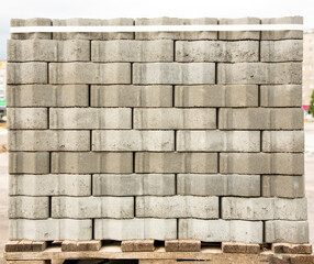 A pallet with gray paving slabs prepared for laying