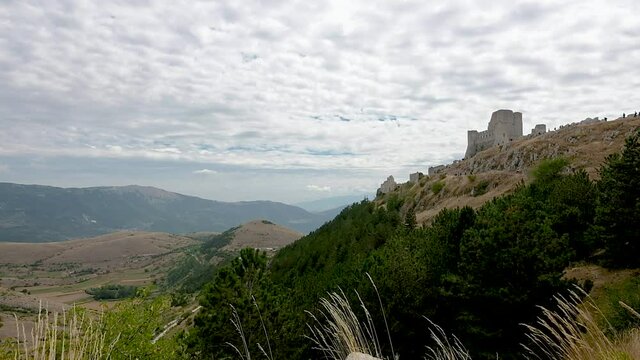 Rocca Calascio Castle, a medieval village located in the Gran Sasso National Park and the Laga mounts, Abruzzo. Located between the Navelli valley and the Tirino valley on a windy summer day