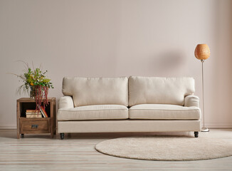 Modern sofa in the light wall concept with lamp and carpet design.