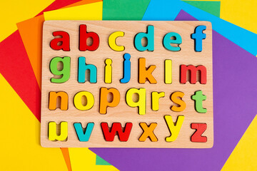 Top view photo multicolor letters of english alphabet on color background. Teaching children