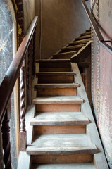 The old narrow wooden staircase