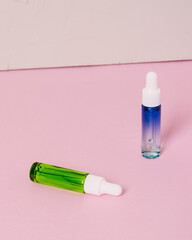 Serum glass bottle set on pink background