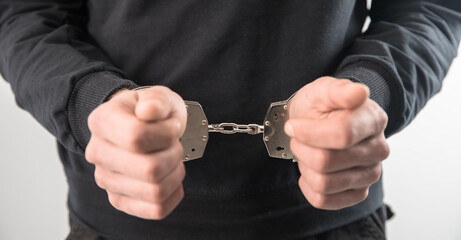 man hand handcuffs