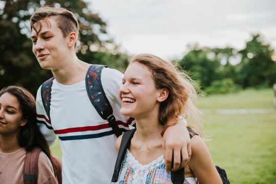 Cheerful teenagers walking in the park