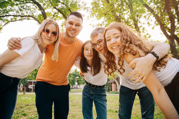 Group of happy young people outdoors in summer