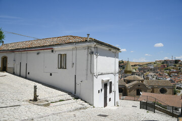A narrow street between the old houses of Rocchetta Sant'Antonio, a medieval village in Puglia region, Italy.