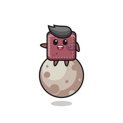 illustration of leather wallet cartoon sitting on the moon