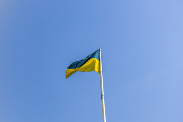 Ukrainian flag on blue sky