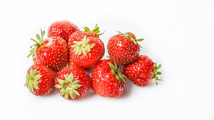 Food banner. Group ripe strawberries on a white background. Sweet juicy strawberries. Organic food. Copy space. Seasonal antioxidant and detox nutrient in human health.