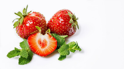 Sweet juicy strawberries and mint leaves. Ripe strawberries and fresh mint on a white background. Food banner. Organic fat-free, low-calorie food. Copy space. Seasonal antioxidant and detox nutrient.