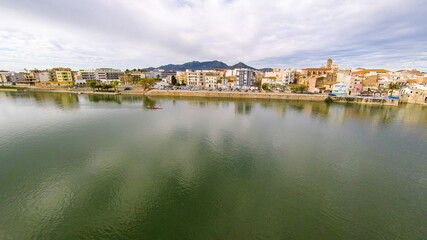 aerial views of the ebro river with boats and villages