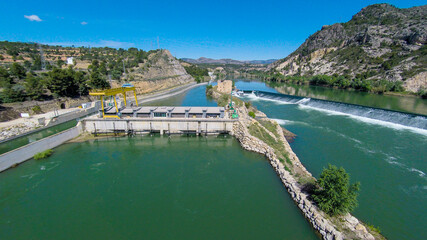 aerial views of the ebro river with boats and villages