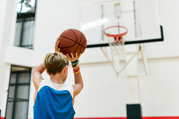 Young basketball player shoot