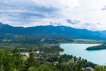 Fototapeta na wymiar Scenic view of Faaker See with the Austrian Alps in the background, Drobollach, Carinthia, Austria