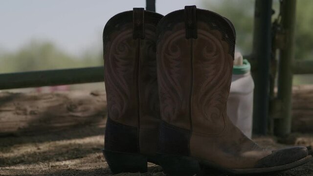Wild West Country Pair of Cowboy Boots Outside at a Farm Still Life.