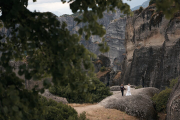 photo shoot at the foot of the mountain in Greece on a background of green trees