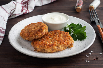 Buckwheat cutlets with cheese and parsley on a plate. Healthy diet food