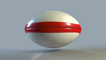 Side profile of 3D Ruby ball spinning in a perfect loop. White rugby ball with red design rotating on the spot with a luma matte. Side on view perfect for perimeter advertising.