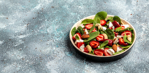 Fresh Tasty salad with strawberry, spinach leaves and cheese. Vegetarian salad. healthy food. Long banner format. top view