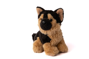 Little toy plush puppy of sheepdog on the white background