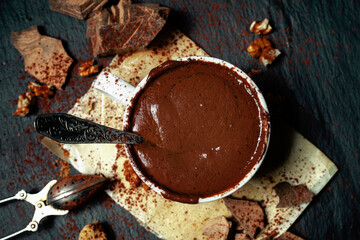 Cup of hot chocolate on black stone background