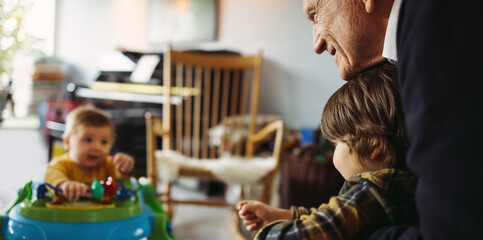 Grandpa with kids at home