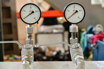 High pressure gauges on the hydraulic oil pump control unit for the hydraulic system.