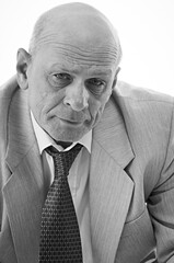 Portrait of handsome bald senior man in tie