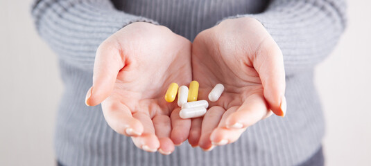 girl holding pills in her hands