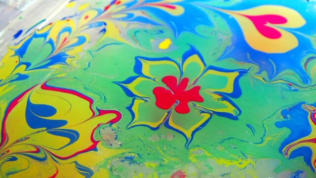 Drawing in the ebru technique, painting on water, abstract drawing, beautiful pattern.