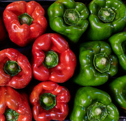 Top view close up red and greeen paprika peppers background