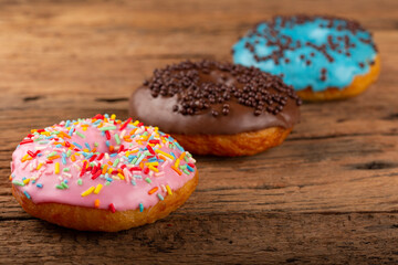 Delicious assorted colorful donuts on the table.