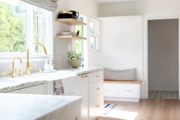 Fototapeta na wymiar Golden kitchen faucet interior design