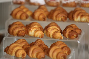 Handmade pieces of cake and croissants