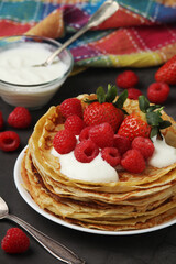Russian cuisine national dish bliny with fresh berries	