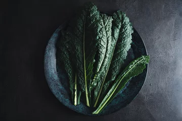 Poster Cavolo nero black curly kale vegetable on black plate © Elisabeth Cölfen