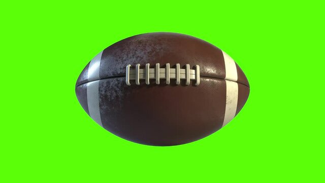 3D American Football spinning on the spot with a green screen. Side on view of a rotating brown and white ball going in a straight line. Perfect for perimeter advertising with the ball's side profile.