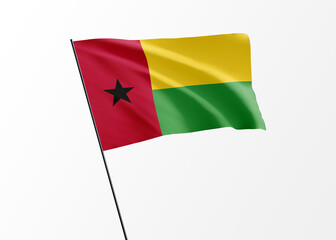 Guinea Bissau flag flying high in the isolated background Guinea Bissau independence day. World national flag collection