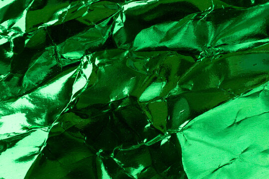 Crumpled Green Foil Paper Texture.