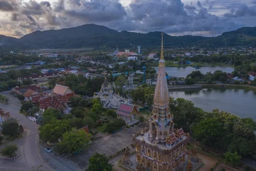 Fotobehang .aerial panorama view scenery sunset above Chalong pagoda in Phuket province..Chalong temple is the one popular landmark in phuket.colorful cloud scape sky sunset.travel culture concept. © Narong Niemhom