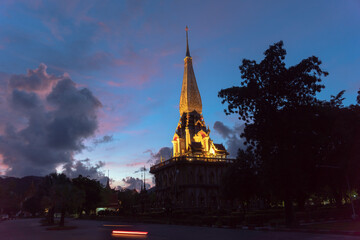 panorama view colorful cloud above pagoda of Chalong pagoda in twilight..beautiful architecture pagoda of Chalong temple in the night..colorful cloud scape sky sunset.