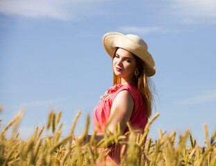 young girl in a rye field