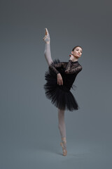 Graceful ballerina dancer with her legs apart