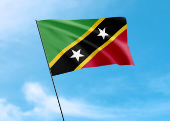 Saint Kitts and Nevis flag flying high in the sky  Saint Kitts and Nevis independence day. World national flag collection