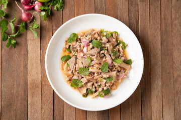 Spicy minced pork salad (Larb moo),Mixed Pork with boiled skin and liver in spicy sauce.Thai food