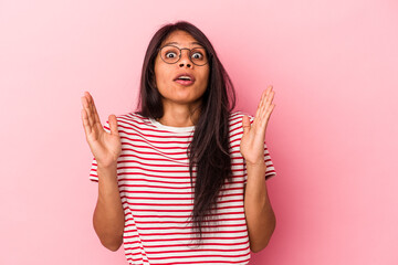 Young latin woman isolated on pink background having an idea, inspiration concept.