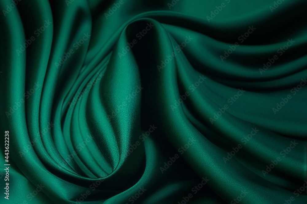 Wall mural texture, background, pattern. texture of green silk fabric. beautiful emerald green soft silk fabric